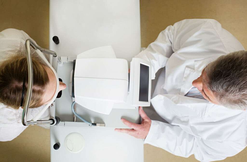 a view from directly above of an optometrist examining a woman's eyes at an eye appointment to treat her keratoconus