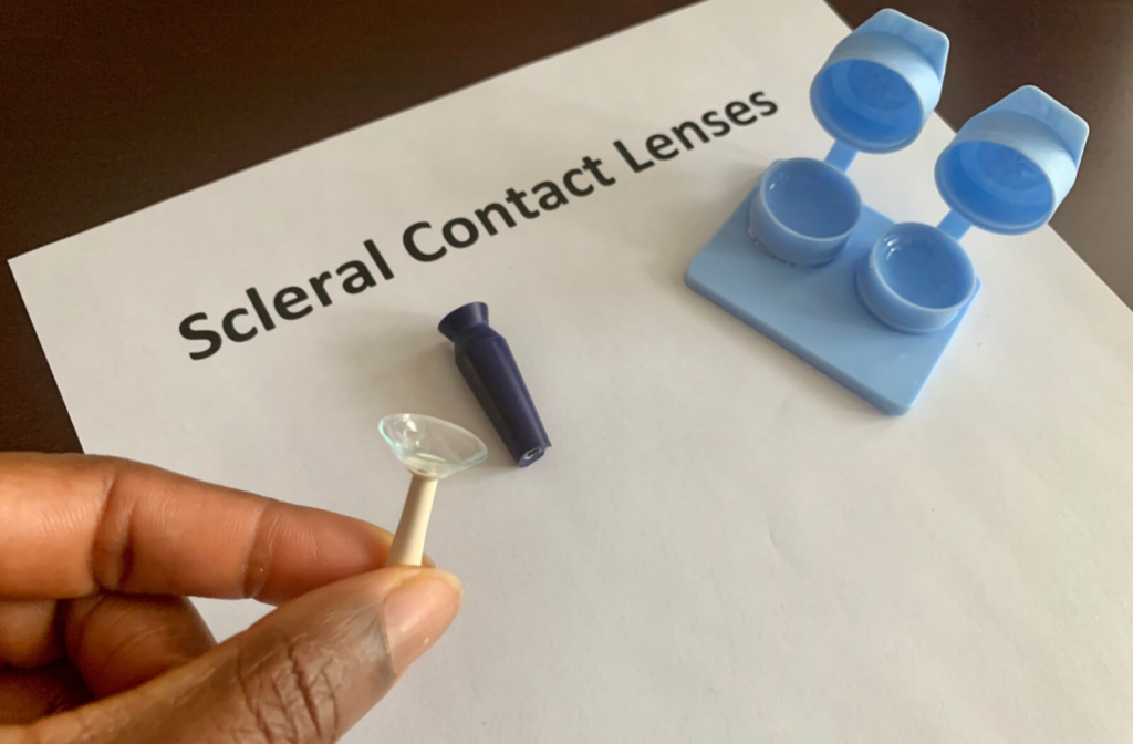 A contact lens case with scleral contacts and a contact lens insertion and removal kit. dry eye